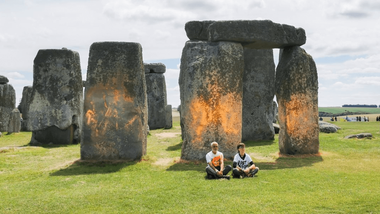 Activists spray Stonehenge with orange powder paint